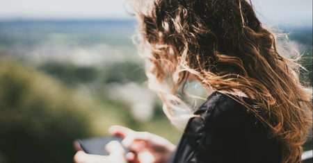 woman using mobile phone outdoors