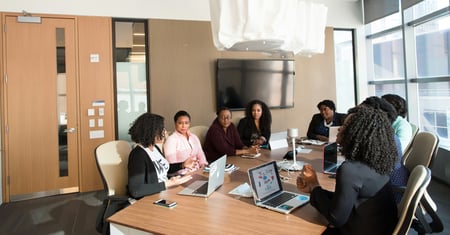 business employees using technology in a meeting